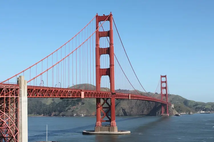 Golden Gate Bridge fun facts highlight the iconic red suspension bridge in San Francisco spanning across the bay