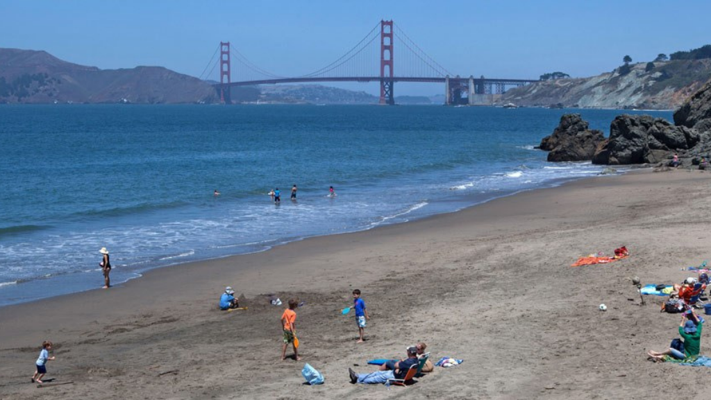 china beach san francisco people playing and sunbathing on china beach in san francisco
