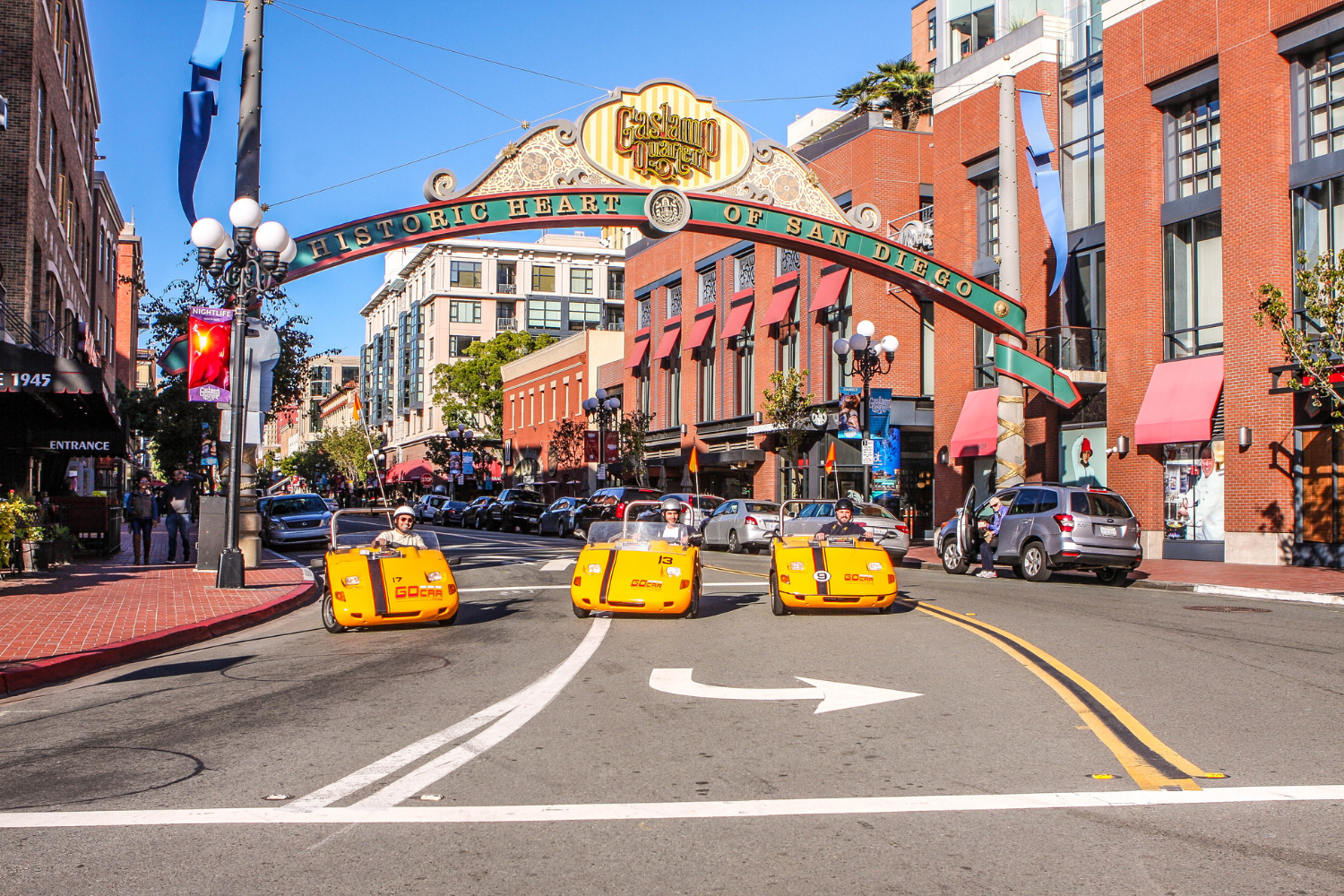 restaurants in the gaslamp quarter san diego GoCars parked in front of the GasLamp quarter entry sign in san diego