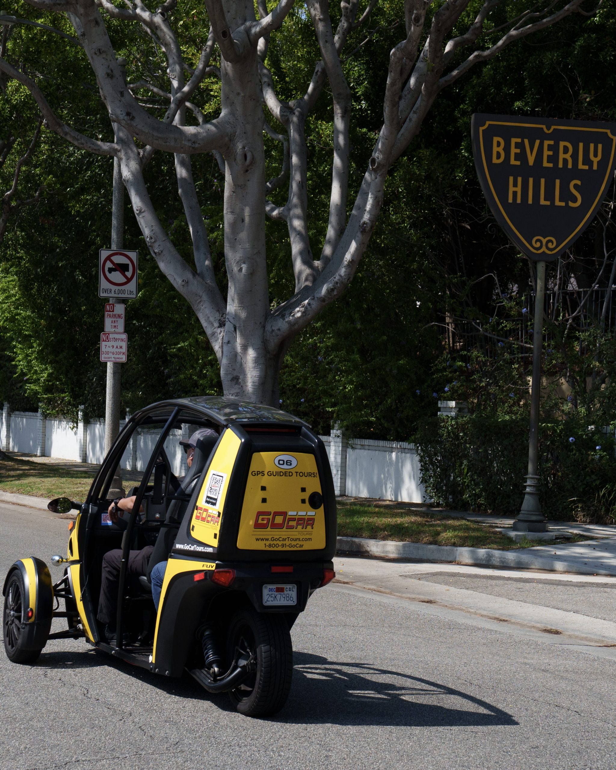 Person sitting in a GoCar under Las Vegas Sign